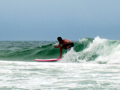 manly o'neil riding tat's big pink board